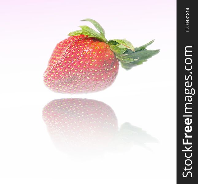 Abstracted manipulated image of strawberry reflected on shiny surface. Abstracted manipulated image of strawberry reflected on shiny surface