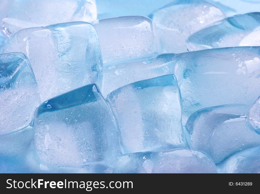 Ice cubes in blue background. Ice cubes in blue background