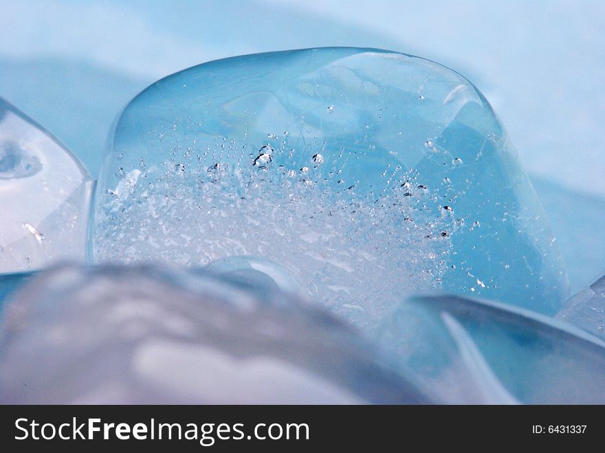 Ice cubes in blue background. Ice cubes in blue background