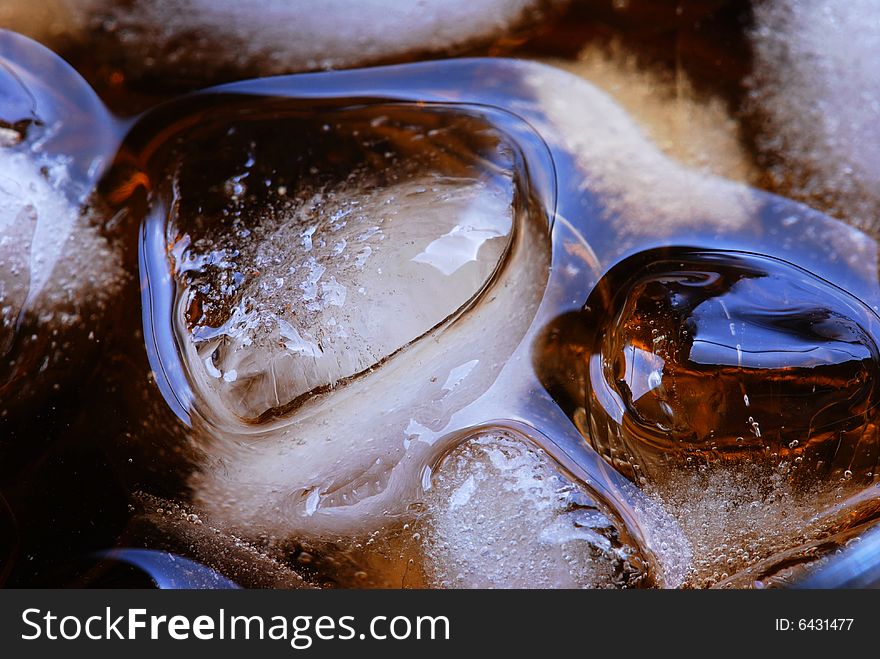 Alcohol drink with ice cube in  cristal glass