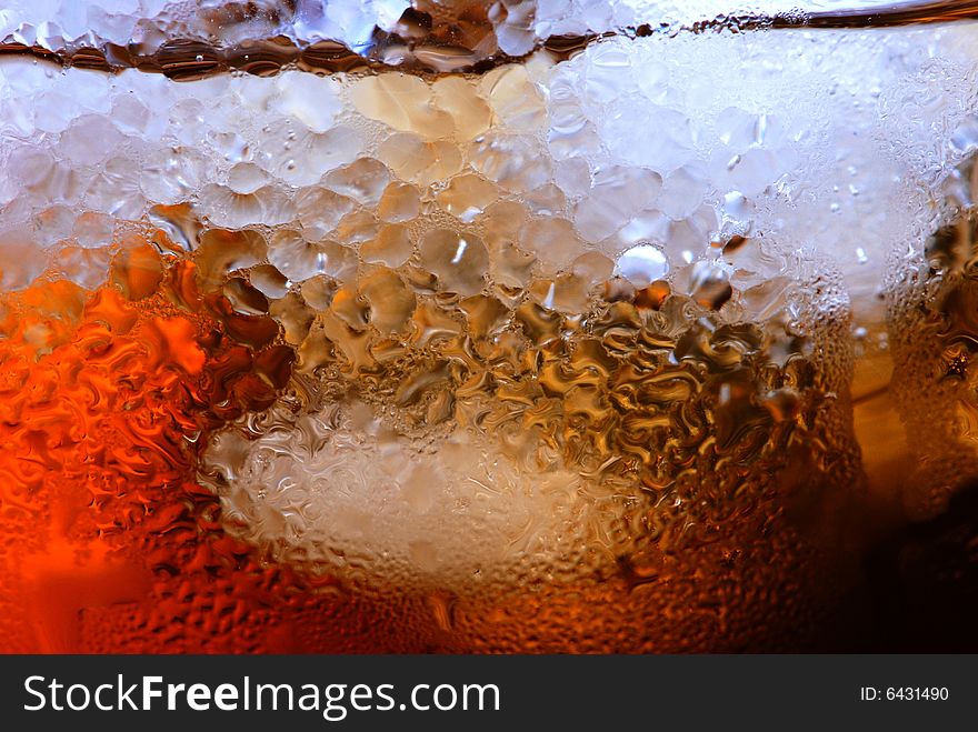 Alcohol drink with ice cube in  cristal glass