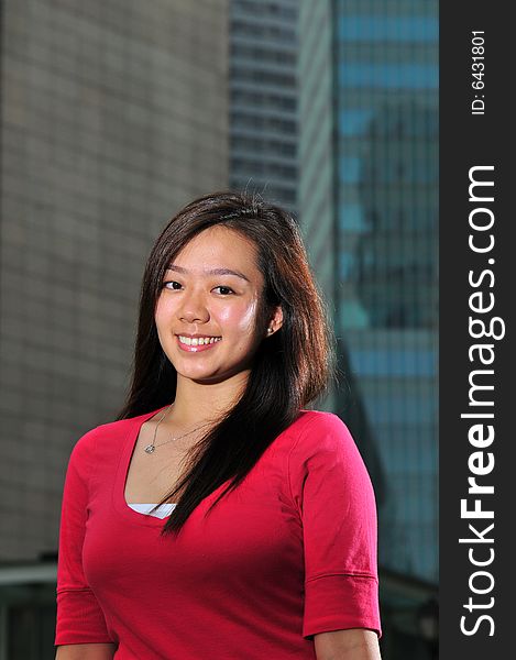 Picture of an Asian Girl with office landscape behind. Suitable for contexts of office environment, casual staff, part-timers, and even interns. Picture of an Asian Girl with office landscape behind. Suitable for contexts of office environment, casual staff, part-timers, and even interns.