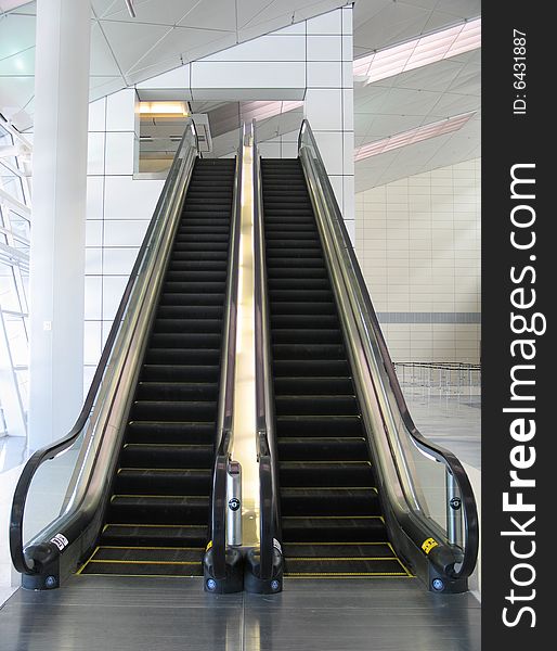 Black modern escalator in a modern building