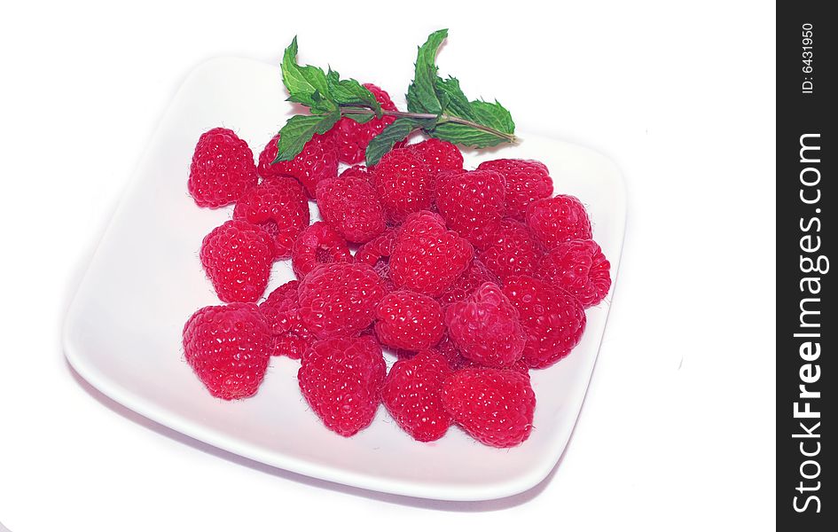 Raspberry On The White Plate