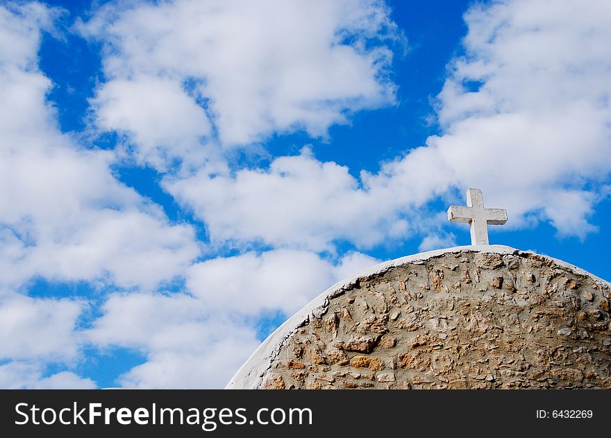 View of an old christian church in Cyprus against a blue cloudy sky. View of an old christian church in Cyprus against a blue cloudy sky