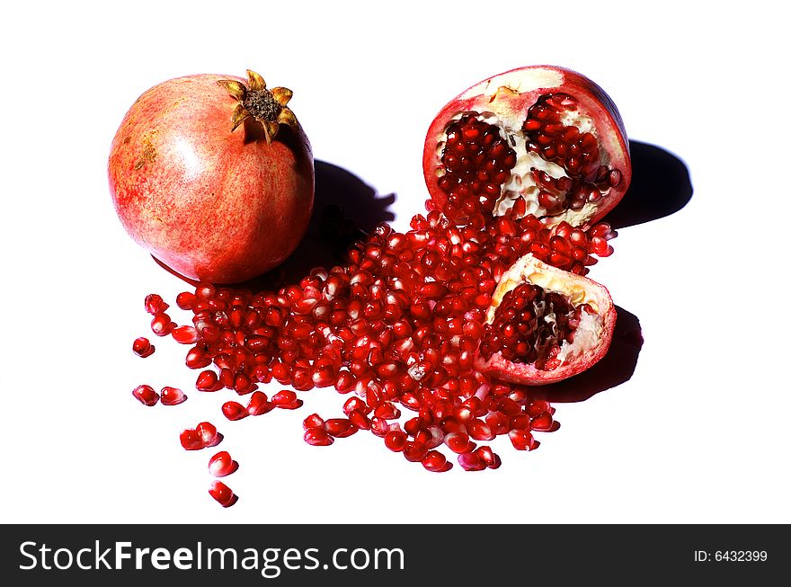 Fresh half and full pomegranate