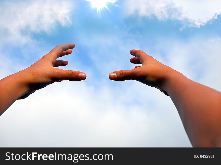 Hands catching the sun, background