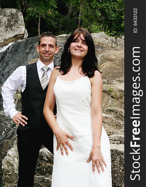 Happy bride and groom on top of a mountain.