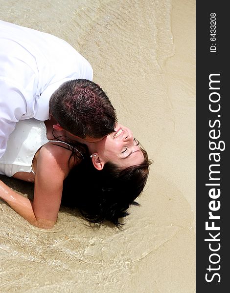 Trash the dress session at the beach with a bride and groom.