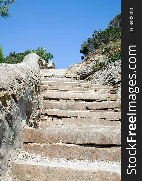 Ladder from a light stone in mountains