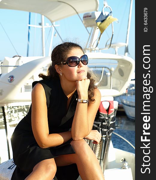 Attractive young woman wearing sunglasses. Attractive young woman wearing sunglasses