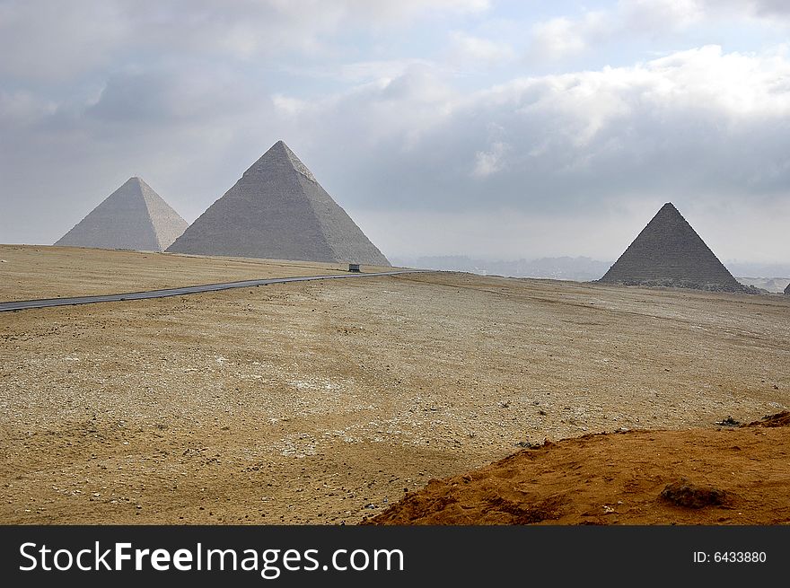 Three pyramids in gisa in cloudy weather