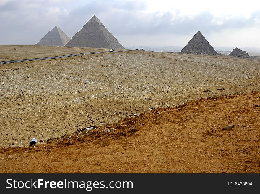 three pyramids in cairo with cloudy background. three pyramids in cairo with cloudy background