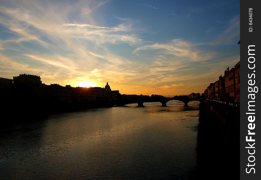 A beautiful image of a sunset on the Arno river in Florence. A beautiful image of a sunset on the Arno river in Florence