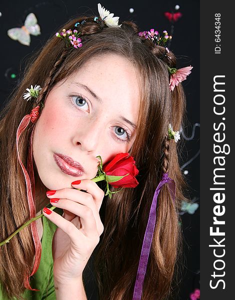 Teenage model with flowers and butterflies in her hair. Teenage model with flowers and butterflies in her hair