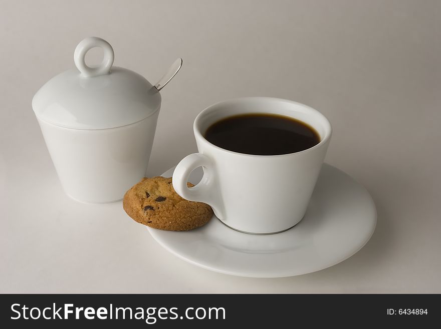 Cup of black coffee and cookies, isolated, clipping path included. Cup of black coffee and cookies, isolated, clipping path included