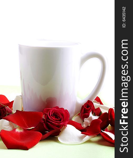 Cup And Rose Petals