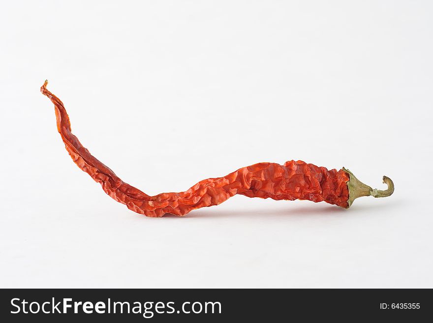 Red hot chili on white background