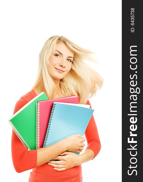 Attractive teenage girl with notebooks isolated on white background