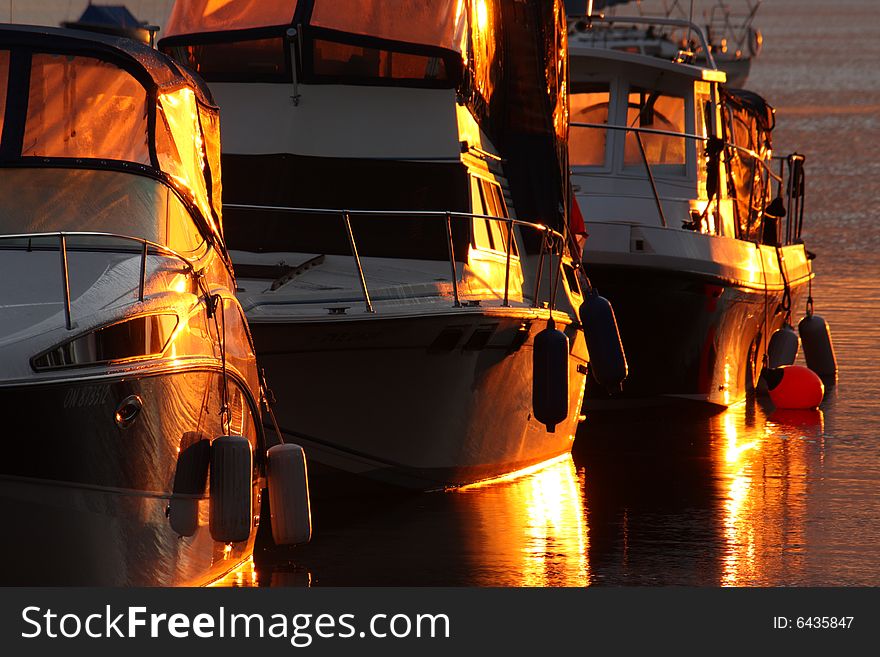 Three boats at sunrise on Ottawa River