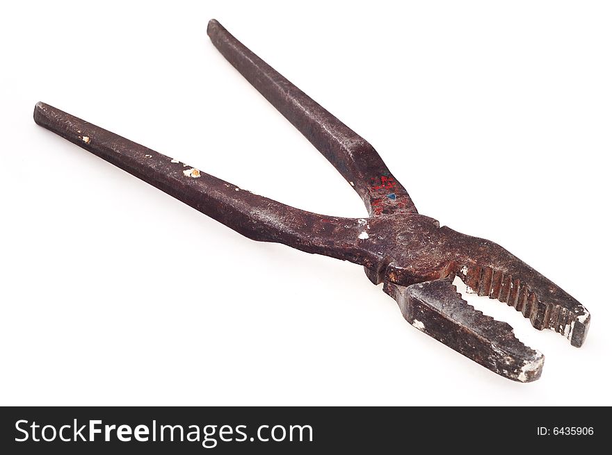 Big metal pliers on the white background. Old, used and rusty. Narrow depth of field. Big metal pliers on the white background. Old, used and rusty. Narrow depth of field.