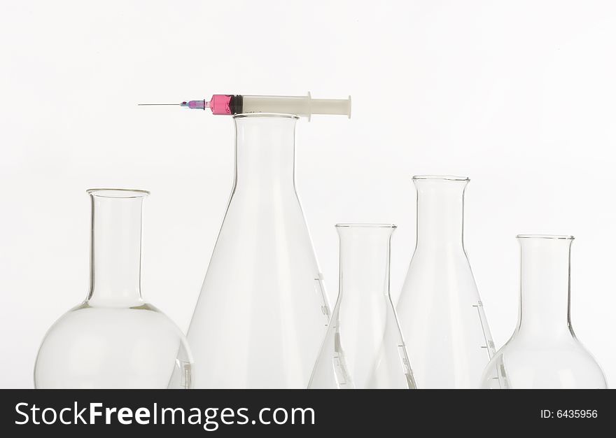 Glassware  and syringe in laboratory