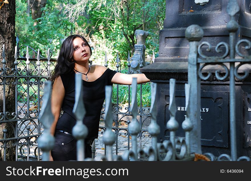 The girl-goth on a cemetery. The girl-goth on a cemetery