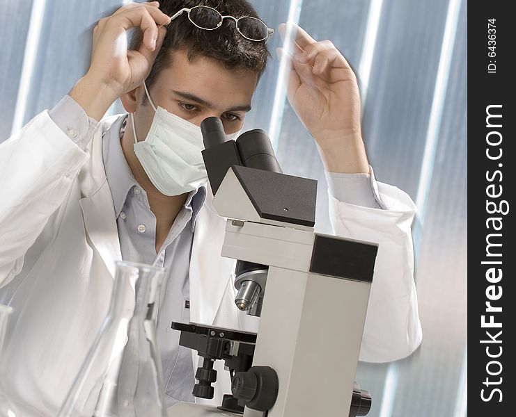 Scientist discovering something at microscope, chemistry related or medical design. Scientist discovering something at microscope, chemistry related or medical design