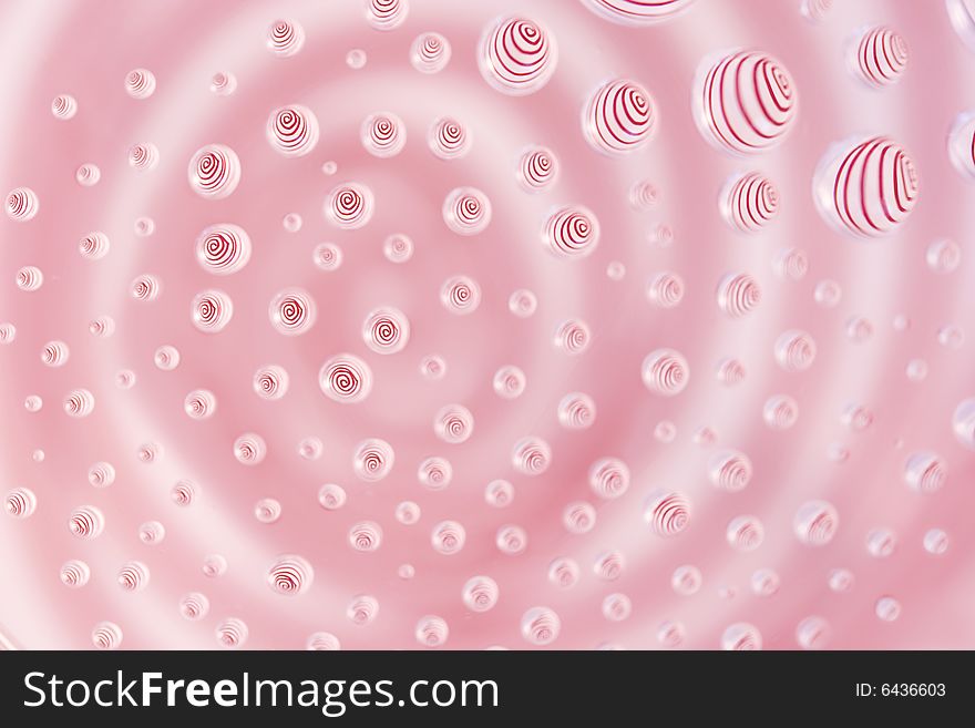 Red Spiral Reflected In Water Droplets