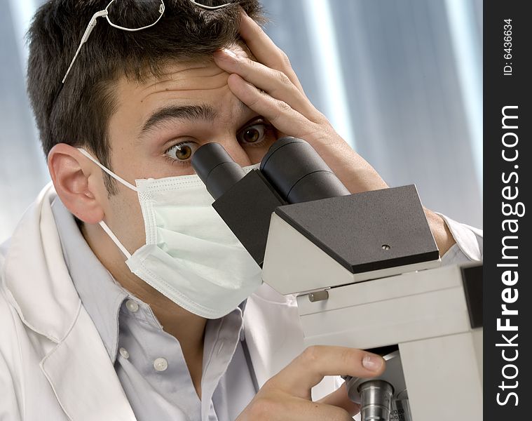 Scientist discovering something at microscope, chemistry related or medical design. Scientist discovering something at microscope, chemistry related or medical design