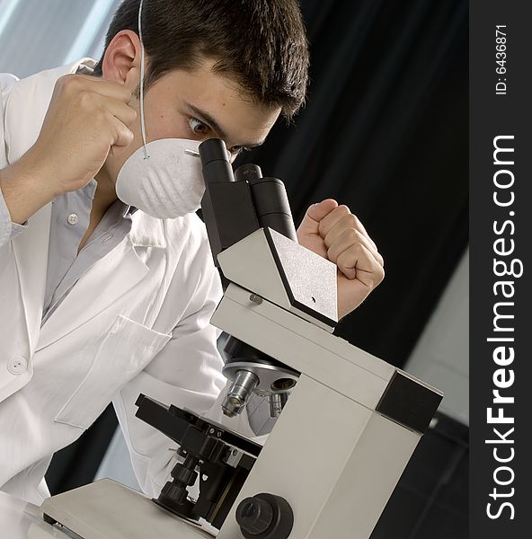 Scientist discovering something at the microscope, chemistry related or medical design. Scientist discovering something at the microscope, chemistry related or medical design