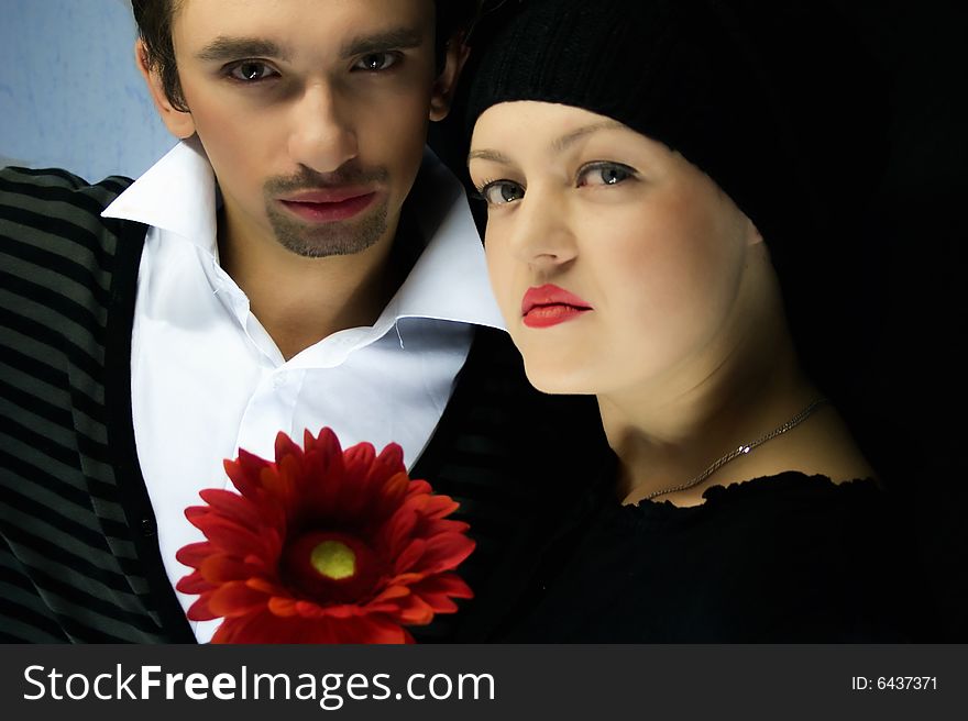 Loving couple with a red flower