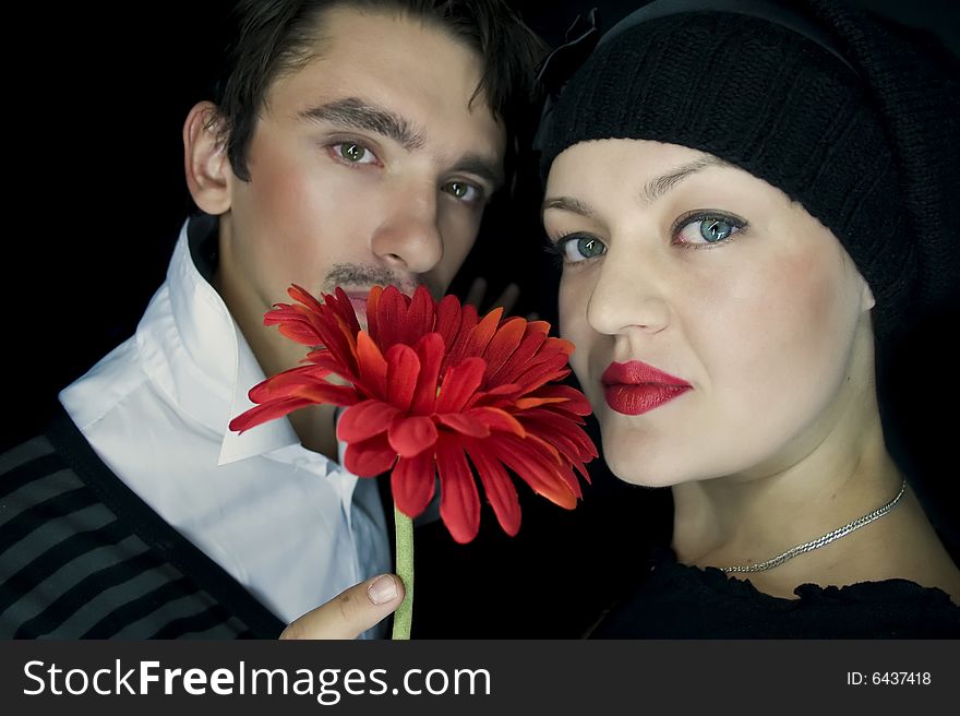 Loving couple with a red flower