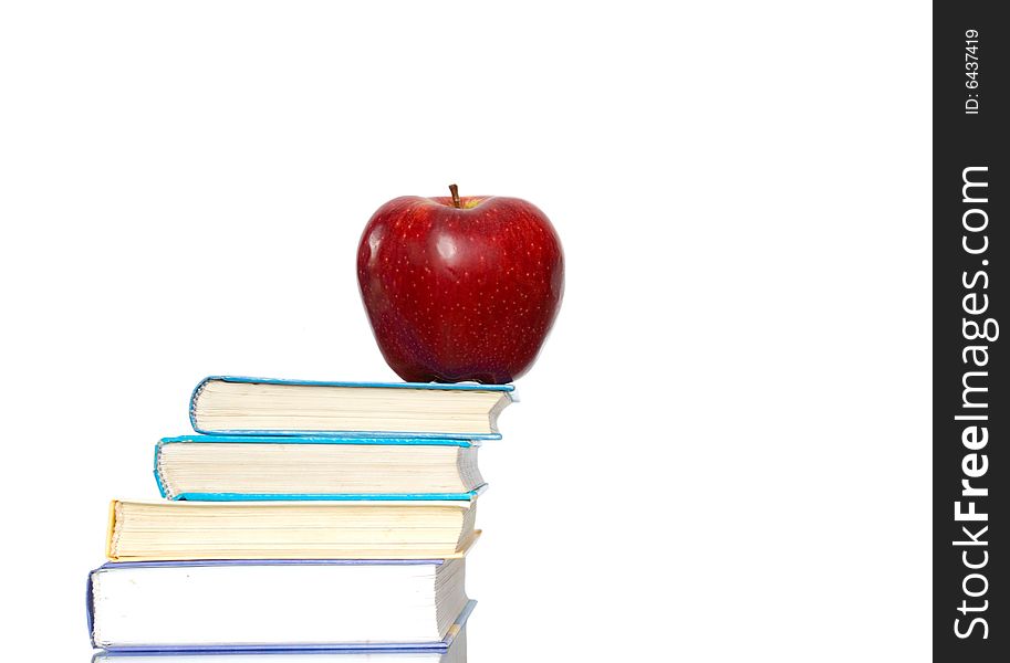 Red apple and stack of books for school. Red apple and stack of books for school