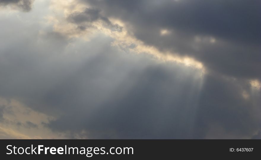 Beams and clouds on  background of  sky