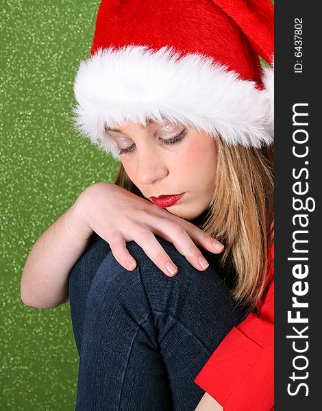 Teenager with red lips wearing a christmas hat. Teenager with red lips wearing a christmas hat