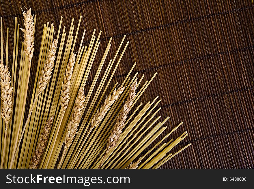 Bamboo board with spaghetti and grain