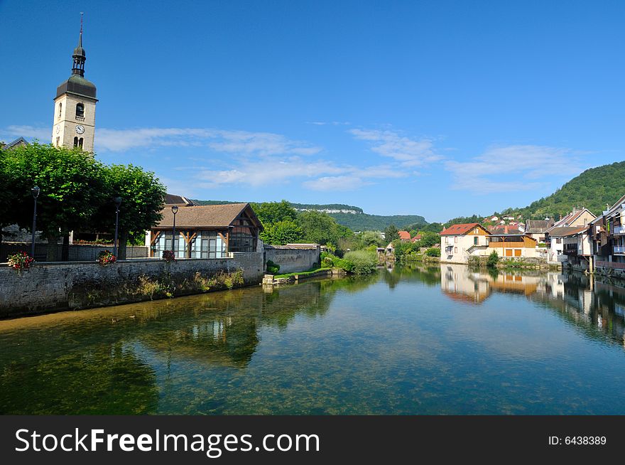 Beautiful little town at the Loue river in France. Beautiful little town at the Loue river in France
