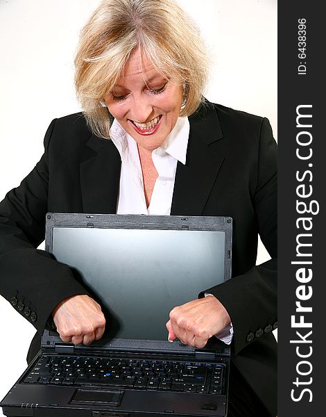 Attractive 40 something woman upset with her laptop. Attractive 40 something woman upset with her laptop.