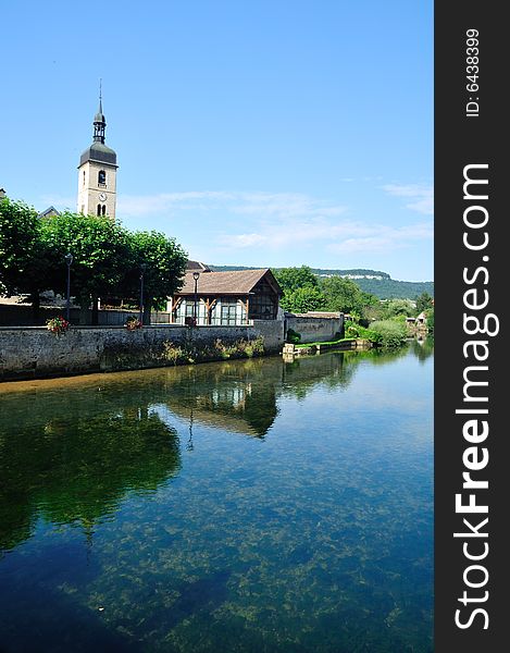 Beautiful little town at the Loue river in France. Beautiful little town at the Loue river in France