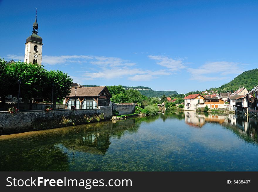 Beautiful little town at the Loue river in France. Beautiful little town at the Loue river in France