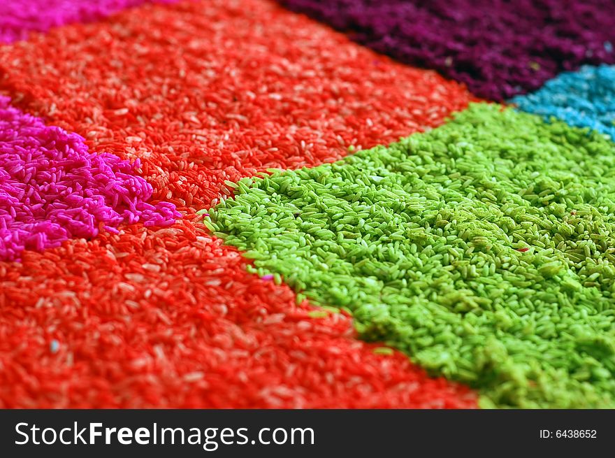 Colorful rice on the floor, one of the Indian culture decorating art for worship festival. Colorful rice on the floor, one of the Indian culture decorating art for worship festival.