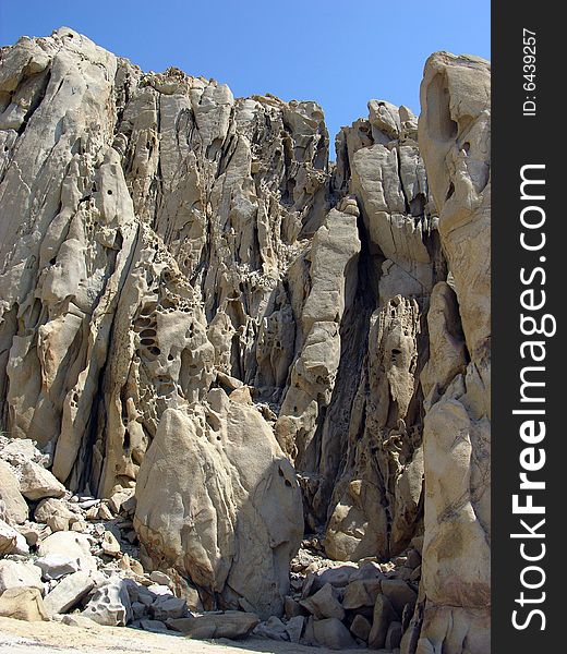 The wall of different shape rocks on Lovers' beach in Cabo San Lucas, Mexico. The wall of different shape rocks on Lovers' beach in Cabo San Lucas, Mexico.