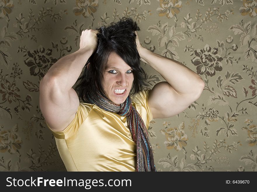 Frustrated Muscular Young Man Pulling Out His Black hair