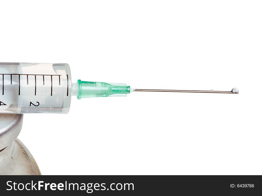 Drop on a tip of a needle of a syringe, it is isolated, on a white background. Drop on a tip of a needle of a syringe, it is isolated, on a white background.