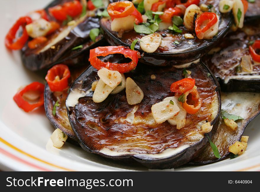 Some fresh aubergines with spices in a bowl