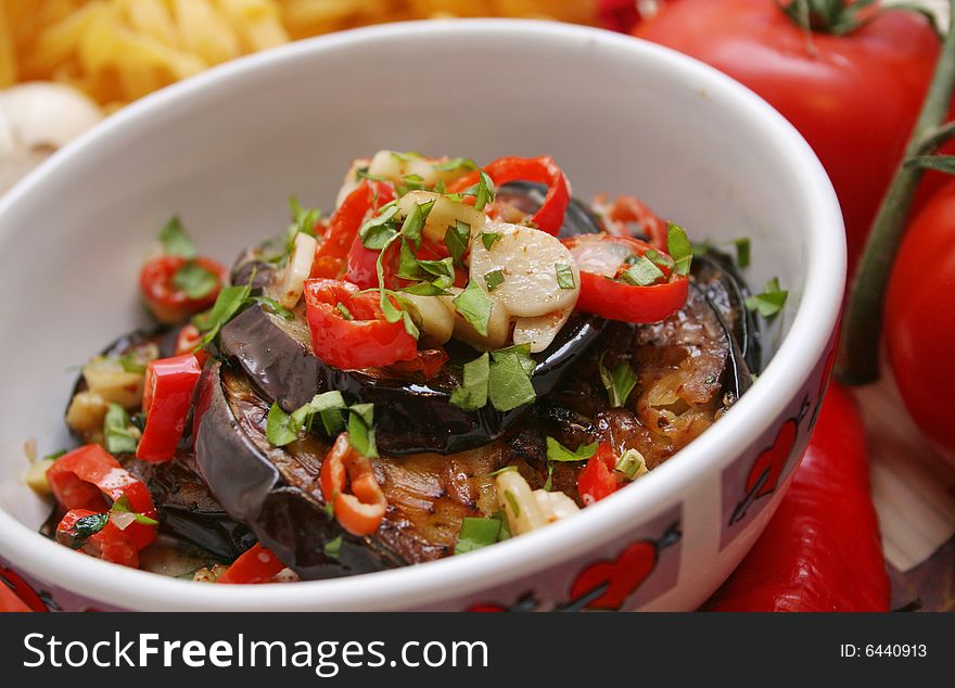 A meal of fresh aubergines with chili and garlic