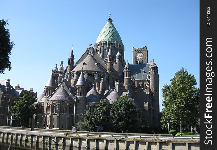 St. Bavo church in Haarlem, the Netherlands. This roman catholic structure was completed in 1925 and has two different towers. St. Bavo church in Haarlem, the Netherlands. This roman catholic structure was completed in 1925 and has two different towers