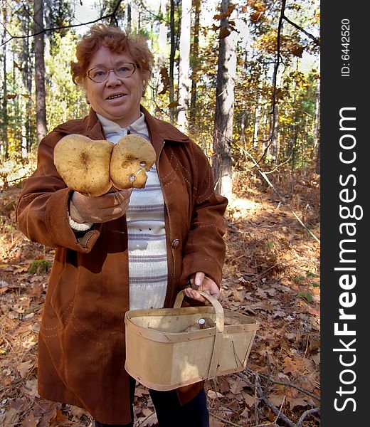 Senior woman outdoor portrait in fall forest. Senior woman outdoor portrait in fall forest