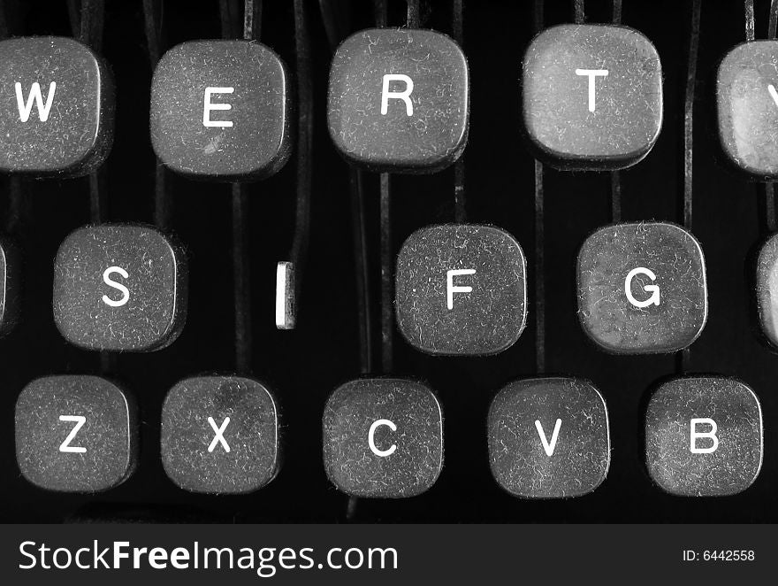 Old dusty typewriter keytops with missing key. Old dusty typewriter keytops with missing key